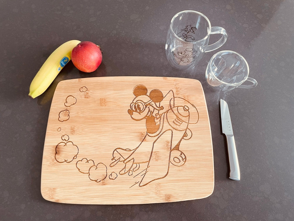 Large bamboo breakfast board with Mickey in an airplane