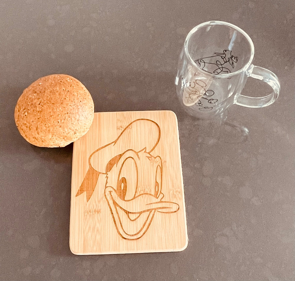 Small bamboo breakfast board with Donald Duck