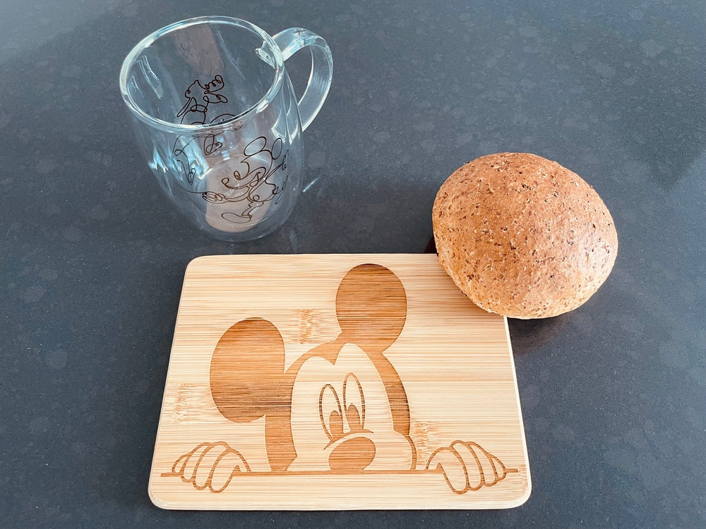 Small bamboo breakfast board with a peeking Mickey