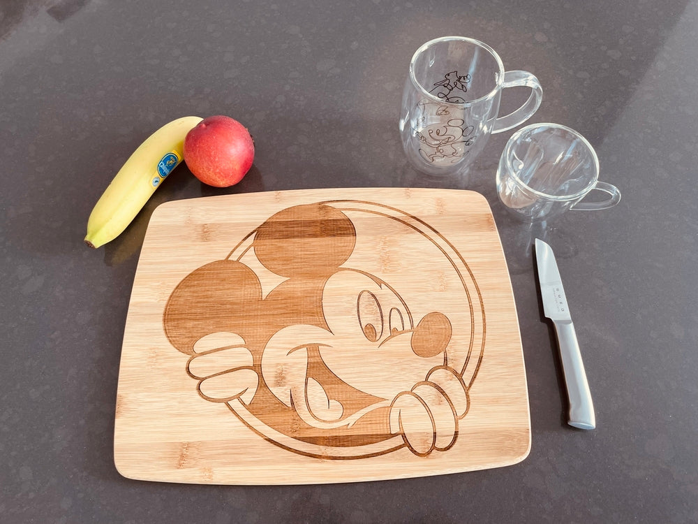 Large bamboo breakfast board with a peeking Mickey